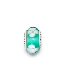 Ethereal white flower lie on a sea of blissful teal Murano glass on this beautiful sterling silver bead. Donatella is a playful collection of charm bracelets and necklaces that can be personalized to suit your style! Available exclusively at Macy's.