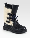 A seasonal leather staple with plush shearling trim and metal-tipped laces. Rubber heel, 1 (25mm)Shaft, 9Leg circumference, 12Leather and shearling upperPull-on styleShearling liningRubber trek solePadded insoleImported