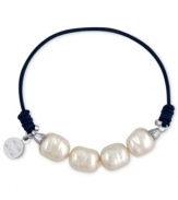 Majorica explores its whimsical side with this bracelet. Organic man-made pearls (8 mm) adorn a navy-blue elastic cord for a fun and fashionable look. Approximate length: 6-1/2 inches.