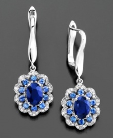 Glorious flowers shimmer in brilliant blue on these stunning earrings featuring round-cut and oval-cut sapphire (2-5/8 ct. t.w.) and round-cut diamond (1/4 ct. t.w.) set in 14k white gold. Approximate drop: 1-1/4 inches.