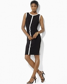 A chic color-blocked shift dress is rendered in figure-flattering matte jersey with elegant ruched detailing.