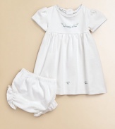 Make your little one look like a doll in this soft two-piece set with pretty scattered flowers. CrewneckShort sleevesScallop trim in contrasting toneEmpire waistBack snap closureBloomers with elastic waist and leg openingsPima cottonMachine washImported