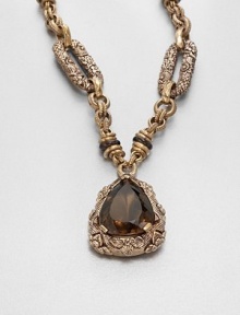 An intricately engraved bronze link chain with a faceted smoky quartz pendant inspired by the designer's love of nature's bounty. BronzeSmoky quartzLength, about 27.5Pendant size, about 2Toggle closureMade in USA