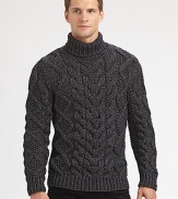 A chunky, cable-knit turtleneck, shaped in a fine wool blend, offers superior warmth and comfort on those brisk, winter days.Ribbed knit cuffs and hem56% wool/44% polyesterDry cleanImported