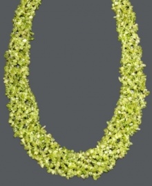 Add a layer of earthy green hues to your neckline. This vivid necklace features layers of peridot gemstone chips (4-6 mm) and a 14k gold toggle clasp. Approximate length: 20 inches.