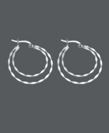 Stylish hoops that make a statement. This unique design by Unwritten features two, graduated, twisted hoops in a sterling silver setting. Approximate diameter: 1-1/5 inches.