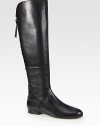 An exposed back zip adds tough-luxe style to this modern leather boot with a stacked heel. Shaft, 18Leg circumference, 14Leather upperExposed back zipLeather lining and solePadded insoleImported