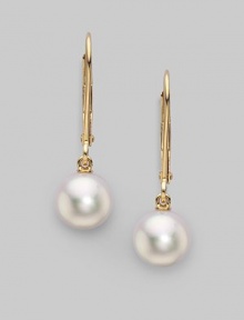 From the Akoya Collection. Classic white cultured pearl drops set in 18k gold. 7mm white round cultured pearls Quality: A+ 18k yellow gold Drop, about 1 Ear wire Imported