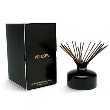 Voluspa Makassar Ebony & Peach Aromatic Reed Diffuser presents an elegant and glamorous fusion of warm ebony wood, rich mahogany, sliced Mirabelle peach and sweet peony.