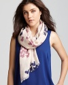 A cute multicolored squirrel pattern accents this oblong scarf from Lola Rose.