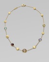 A colorful array of faceted semi-precious gemstones, interspersed with freeform discs of 18k gold, creates a look of modern grace. Multi gemstones 18k yellow gold Length, about 16½ Lobster clasp Made in Italy Please note: Stones may vary.