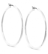 Simply chic. Anne Klein's hoop earrings are crafted from silver-tone mixed metal and add a touch of elegance for any affair. Approximate diameter: 1-1/2 inches.