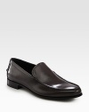 A finely crafted, moccasin-style slip-on is distinguished by debossed logo detail and stacked leather heel. Leather liningPadded insoleLeather soleMade in Italy