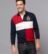 Best blocking. Cool will be just your style in this contrasting, color-blocked Tommy Hilfiger polo shirt.