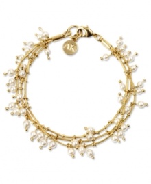 Three's the magic number. Anne Klein's three-row stretch bracelet decorates your wrists with pretty plastic pearls. Crafted in gold tone mixed metal. Stretches to fit wrist. Approximate length: 7-3/4 inches.