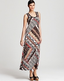 Work this season's passion for pattern in this Calvin Klein maxi dress, touting a graphic mix of animal prints for a vibrant walk on the wild side.