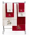 Ring in the holiday season in Lenox style. Featuring soft cotton embellished with festive holly-and-ribbon embroidery and tasteful touches of gold, this hand towel charms your bath with seasonal elegance.