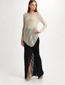 Gossamer wool-blend in an airy chevron knit dips to a point at front hem.Banded round neckline Long sleeves Asymmetrical hem About 36½ long 88% wool/12% nylon Dry clean Imported