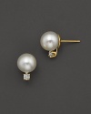 Cultured Akoya pearl stud earrings with a diamond accent.