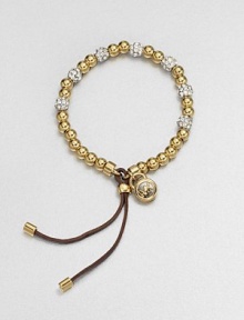 A radiant goldtone beaded design accented with rhinestone encrusted beads and a supple leather closure. Goldtone steel and brassGlass stonesDiameter, about 2.25 adjustableBeaded leather closureImported 