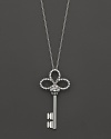 From the Tiny Treasures collection, a diamond accented key necklace with signature ruby accent. Designed by Roberto Coin.