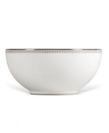 Like the grosgrain ribbons that dangle from her famous dresses, this white bone china collection of dinnerware and dishes from Vera Wang features two different platinum grosgrain borders. The wide corded border of textured grosgrain evokes soft elegance while the narrow wisp of platinum edging adds chic style. Serving bowl shown left.