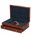 Royal blue lining provides the perfect backdrop for your cherished jewelry in this elegant cherry wood jewelry box. Solid brass drawer pulls and brass-finished side handles add a traditional touch.