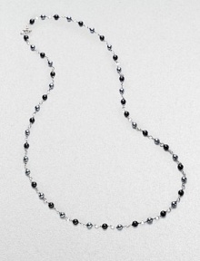 From the Bijoux Collection. A long elegant sterling silver strand of black onyx and hematite beads.Black onyx, hematite Sterling silver Length, about 40 Toggle closure Imported