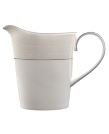 A graceful, classic shape makes this creamer the perfect complement to the Etoile covered sugar bowl. From innovative designer Monique Lhullier's collection of dinnerware and dishes, it features a pearlescent border with glossy raised dots and a fine stitch-like pattern.