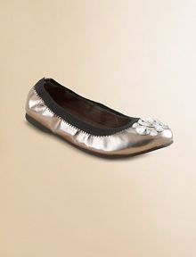 Shiny metallic faux leather, glamorously adorned with chunky rhinestones on the toe.Faux leather upperContrast elastic edgingMicrosuede liningPadded insoleRubber composite soleImported