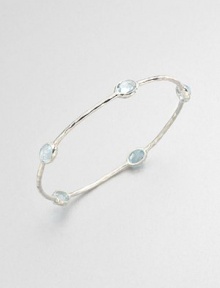 From the Rock Candy® Collection. Five faceted blue topaz stations set on a hammered sterling silver bangle. Blue topazSterling silverDiameter, about 2.5Slip-on styleImported 