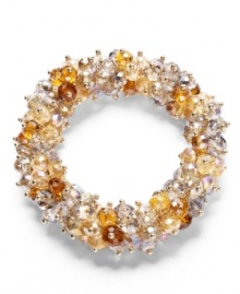 An elegant effect. Sparkling crystals, seed beeds and faceted glass rondelle beading in a pretty champagne palette stand out on this stylish stretch bracelet from c.A.K.e. by Ali Khan. Made in mixed metal, the stretch design lets it slip on and off with grace and ease. Approximate diameter: 2 inches.