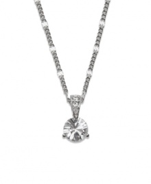 Capture a look of sparkle and simplicity. This elegant necklace by Swarovski is perfect for any occasion with its round-cut solitaire crystal design accented by a crystal-coated bail. Setting and chain crafted in silver tone mixed metal. Approximate length: 18 inches. Approximate drop: 3/4 inch.