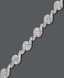 Have her unwrap the perfect gift this season. This stunning tennis bracelet by Wrapped in Love(tm) features three sleek rows of round-cut diamonds (1 ct. t.w.) set in 14k white gold. Approximate length: 7-1/4 inches.