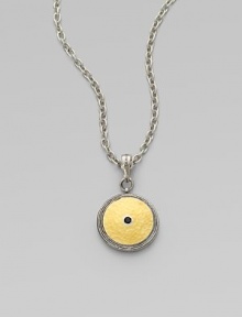 From the Shield Collection. An aptly named disc pendant of hammered 24k gold sits in a richly granulated frame of sterling silver with a faceted black spinel stone at its center.Black spinelSterling silver and 24k yellow goldAdjustable chain length, about 16-18Pendant diameter, about ¾Hook claspImported