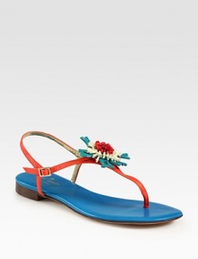 Leather slingback in a modern colorblock design with a thong front and flower embellishment in full bloom. Beaded leather upperLeather lining and solePadded insoleImportedOUR FIT MODEL RECOMMENDS ordering true size. 