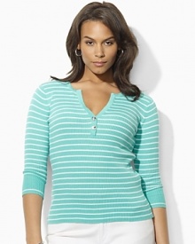 A deep split neckline finished with silver-toned buttons lends modern allure to a classic striped Henley in soft ribbed cotton.