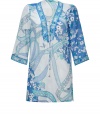 Blossom into warm weather chic in Emilio Puccis whimsical floral print cotton-silk tunic - Laced V-neckline, 3/4 sleeves, contrast print trim - Loosely fitted - Wear over swimwear with bright sandals and a straw tote, or layer over tissue tanks with slim trousers and heels