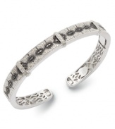 A style refresh. Stunning round-cut white diamonds (3/10 ct. t.w.) and black diamonds (1/10 ct. t.w.) form a sophisticated pattern on this sparkling bangle. Set in sterling silver. Approximate diameter: 3-1/2 inches.