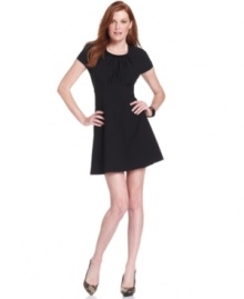 Vince Camuto's short-sleeve A-line dress features a seamed waist and gathered details for the ultimate fit. Deck out with shimmering or colorful accessories to make a flawless party look.