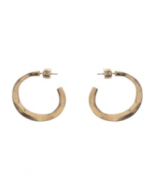 Spruce up your look with essential accessories. 3/4 style hoops by Kenneth Cole New York feature a post setting in worn gold tone mixed metal. Approximate diameter: 1 inch.