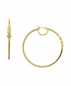 Golden tones with subtle sparkle. These hoop earrings from Vince Camuto are embellished with shimmering crystal stones. Crafted in gold tone mixed metal. Approximate diameter: 2-1/2 inch.