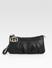 Wristlet with interlocking G charm in guccissima leather with leather trim and nickel hardware.Wristlet strap, 4 drop Zip-top closure Fully lined 8¾W X 4½H X ½D Made in Italy