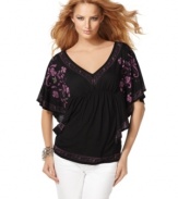 A flowing printed top from INC adds eye-catching appeal to any outfit!