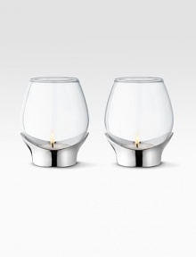 A masterful balance between strength and poetry, handcrafted in glass with a bulb-like shape that disperses soft candlelight. From the Grace CollectionSet of 2 Glass with stainless steel base3¼H X 3 diam.Hand washImported