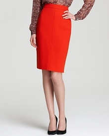 A zesty clementine hue freshens the classic RAOUL pencil skirt, finished with two back zips for a dramatic exit.