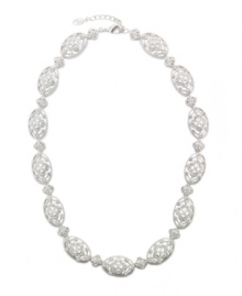 Eliot Danori's gorgeous Les Fleurs collar necklace glitters with an assortment of cubic zirconias (1-1/3 ct. t.w.) and glass crystals. Made in silver tone mixed metal. Approximate length: 16 inches + 2-inch extender.