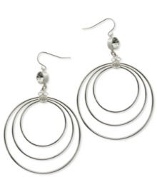 A trio of hoops in differing sizes complement the shimmering crystal accents and Quatro G logo charms on these earrings from GUESS. Crafted in silver tone mixed metal. Approximate drop: 2-3/4 inches. Approximate diameter: 2 inches.