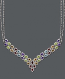 Elevate your look with this fine touch of luxury. This stunning multi-stone v-shaped necklace highlights oval -cut blue topaz (4-1/2 ct. t.w.), peridot (4 ct. t.w.), citrine (3-1/2 ct. t.w.), amethyst (3-1/2 ct. t.w.) and garnet (2-1/2 ct. t.w.). Set in sterling silver. Approximate length: 18 inches. Approximate drop width: 3 inches.