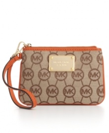 MICHAEL Michael Kors' classic monogram jacquard wristlet gets a fun energy with vibrant contrast leather trim in a variety of hot hues, while the 18K gold logo plaque adds luxe appeal.